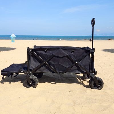 L'ampio vagone di piegatura della ruota accetta il carretto piegante a quattro vie su misura della spiaggia